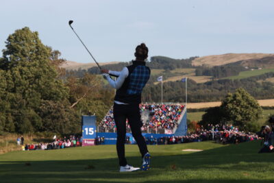 A man preparing to hit a golf ball
