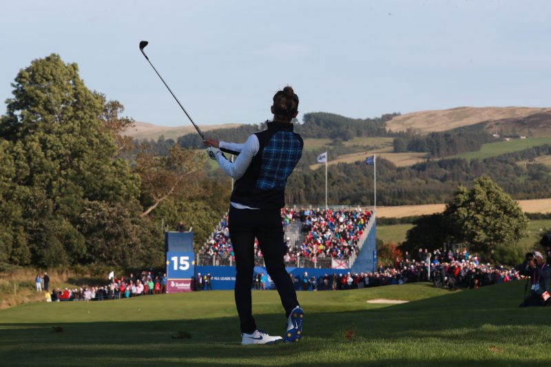 A man preparing to hit a golf ball
