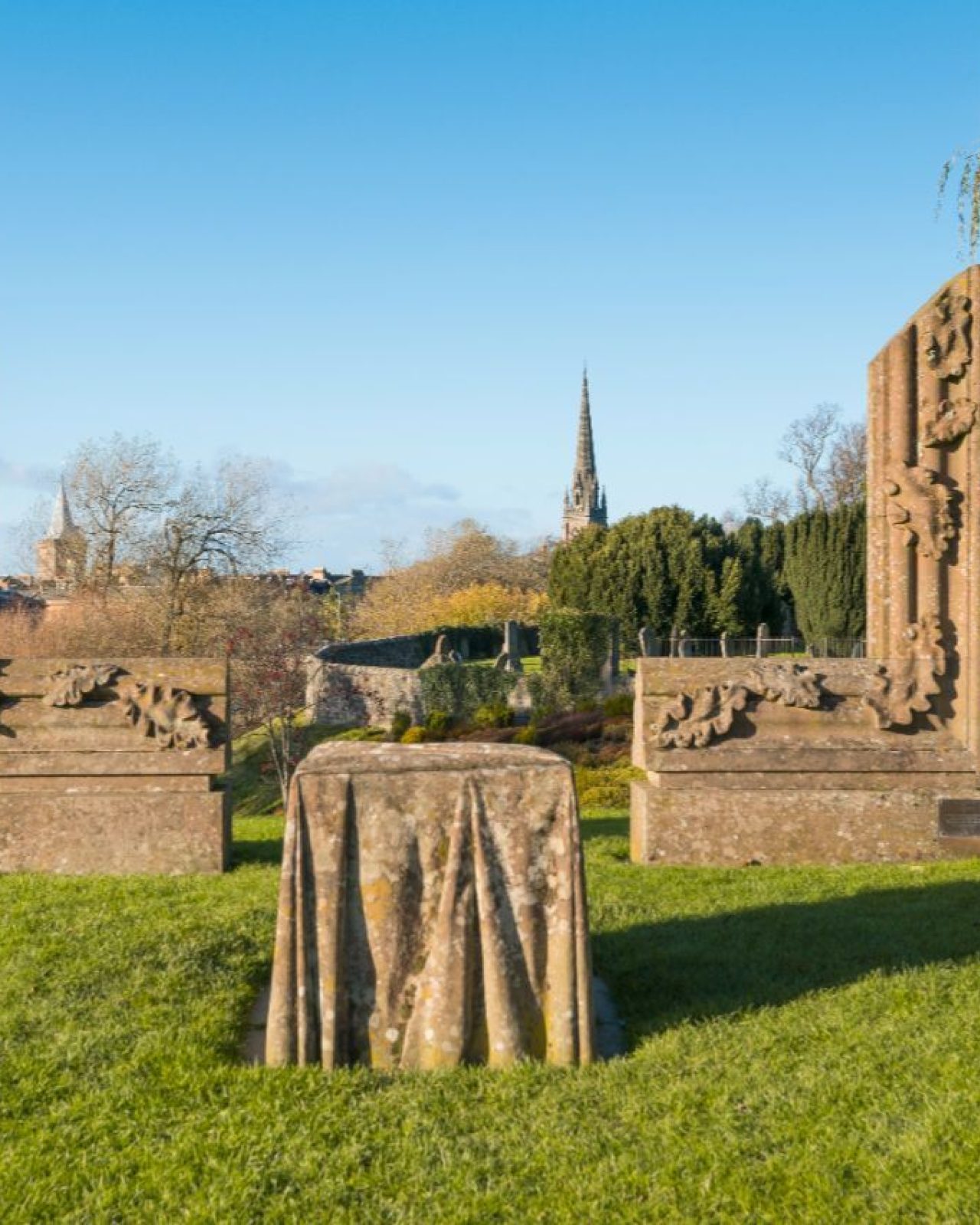 A partially built large stone picture frame with a stone table in the middle