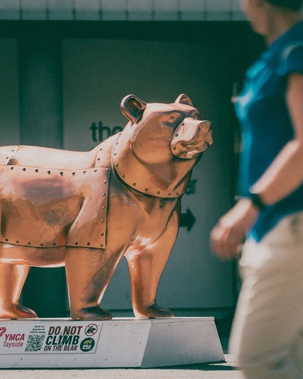 A cermaic bear painted to look like it is made of copper to represent the industrialisation.