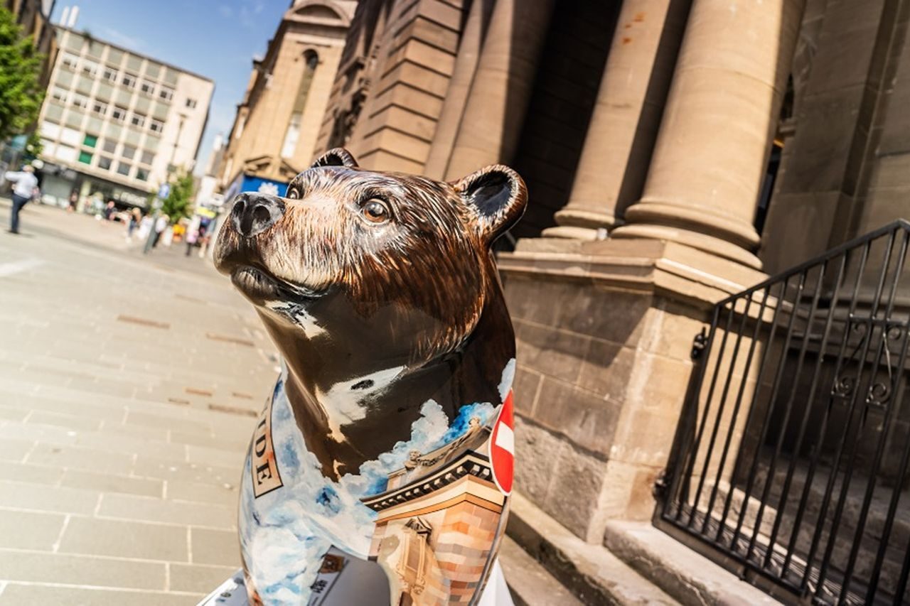 A brown bear with Perth Museum painted on it outside the real Perth Museum.
