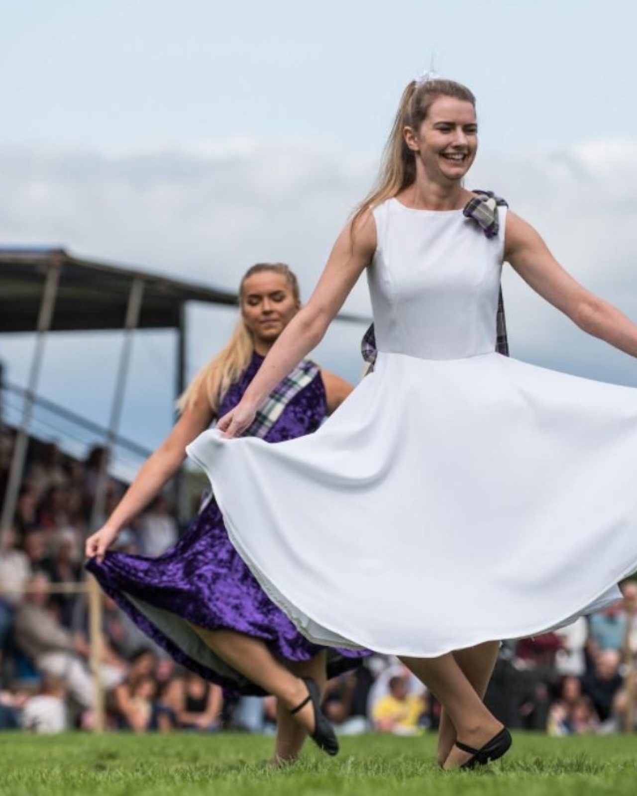 Woman wearing a white dress dancing