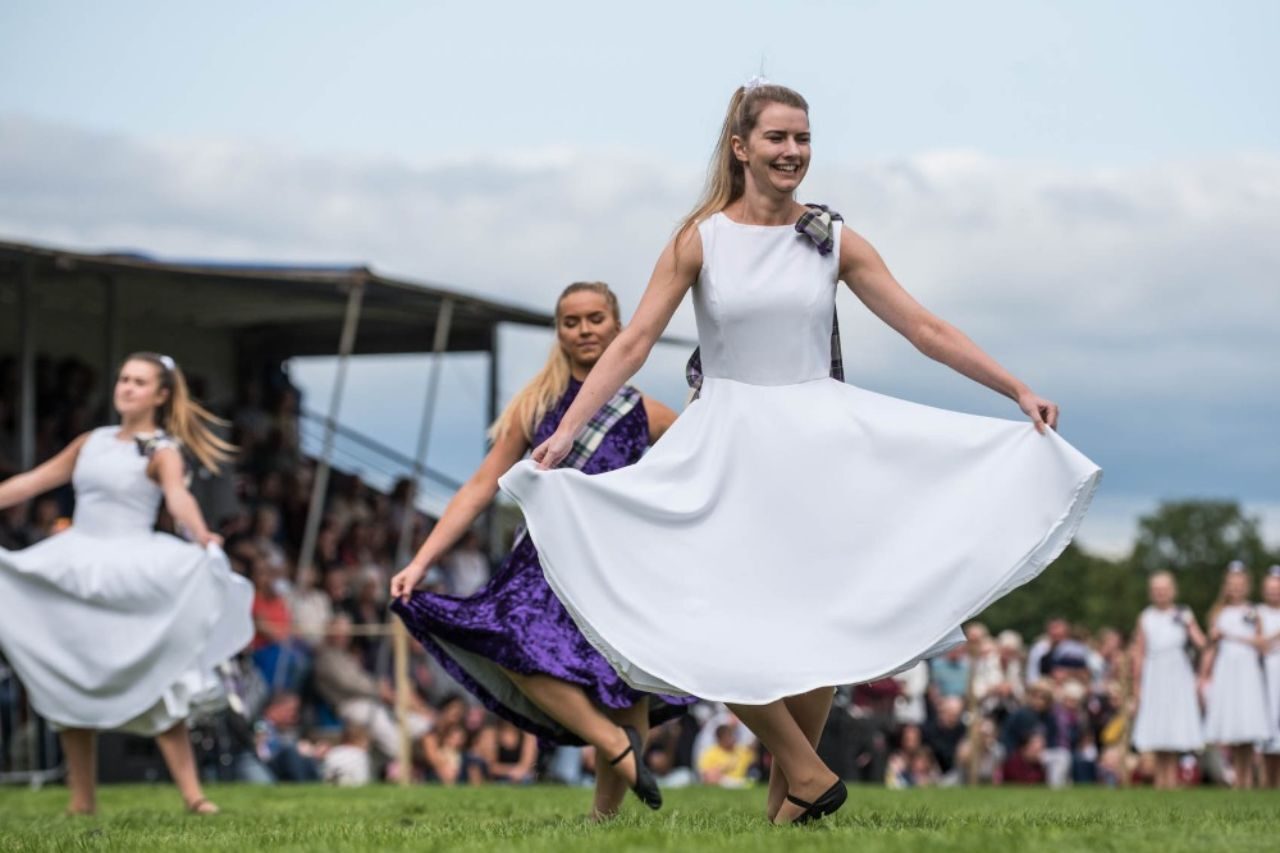 Woman wearing a white dress dancing
