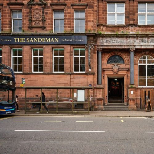 Large red sandstone building, black signage for The  Sandeman in Perth, Scotland