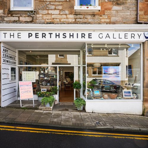 A white building with a black sign which reads 'The Perthshire Gallery'