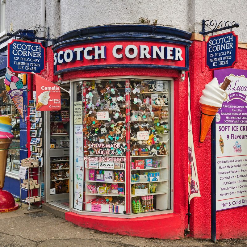 A red building with navy accents. The sign reads in large letters 'Scotch Corner.'