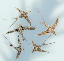 A collection of handmade birds which are woven