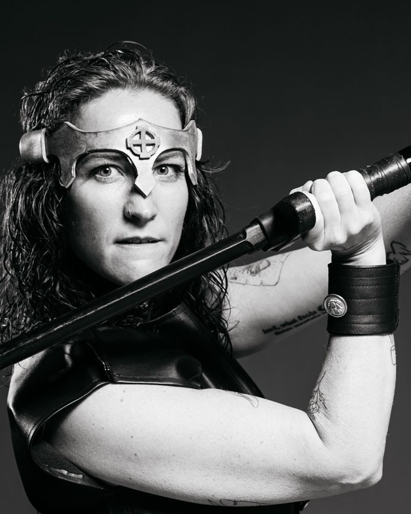 Black and white picture of a woman with a crown holding a sword