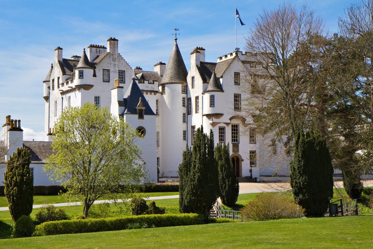 A large white castle and its grounds
