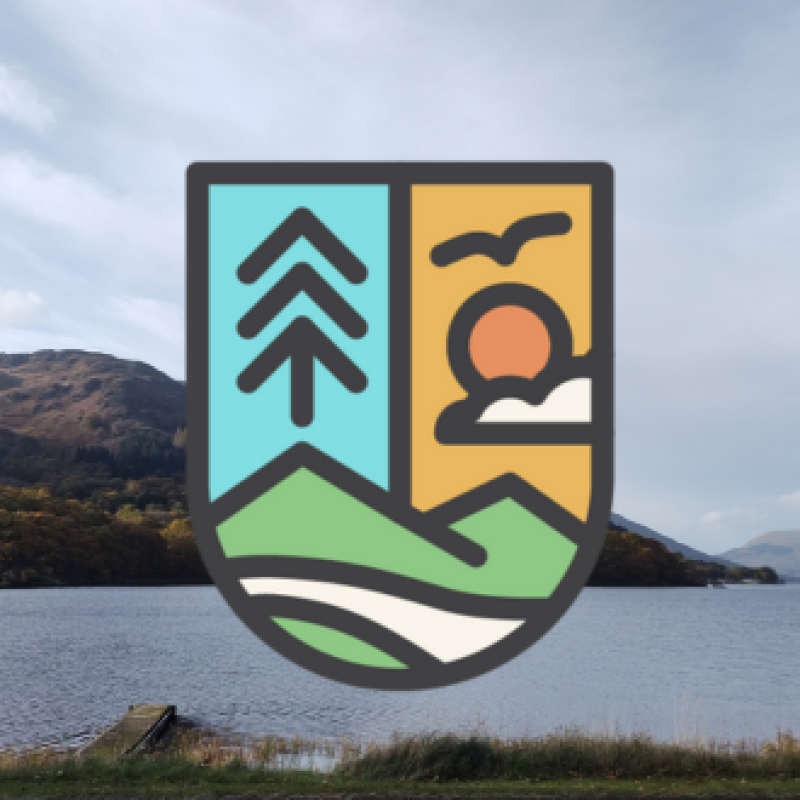 A cartoon crest-shaped logo designed with mountains, trees, and a sun